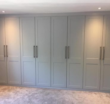 Full-height matte grey hinged wardrobe with panel detailing - Dreamline Interiors