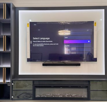 Modern TV Wall with Marble and Wooden Accent Panels - Dreamline Interiors