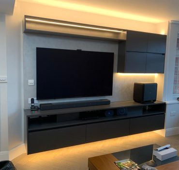 Two-Tone Media Wall with Built-In Storage and Workspace
