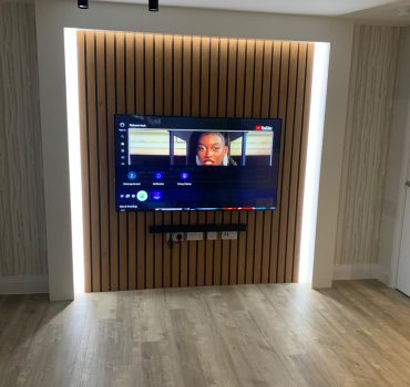 Vertical Slat TV Wall with Ambient Lighting